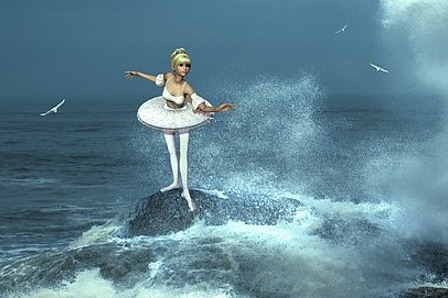 Zdjęcie przedstawia baletnicę stojącą na skale w samym środku oceanu i  fruwające  wokół niej mewy.