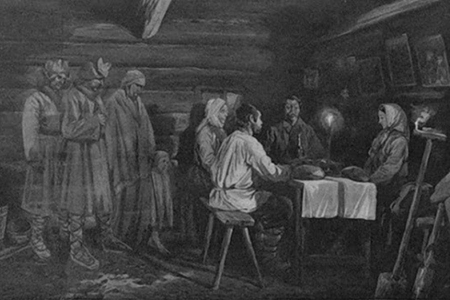 wnętrze starej chaty, przy stole siedzi czworo ludzi obok stołu stoją trzej mężczyźni i dziecko